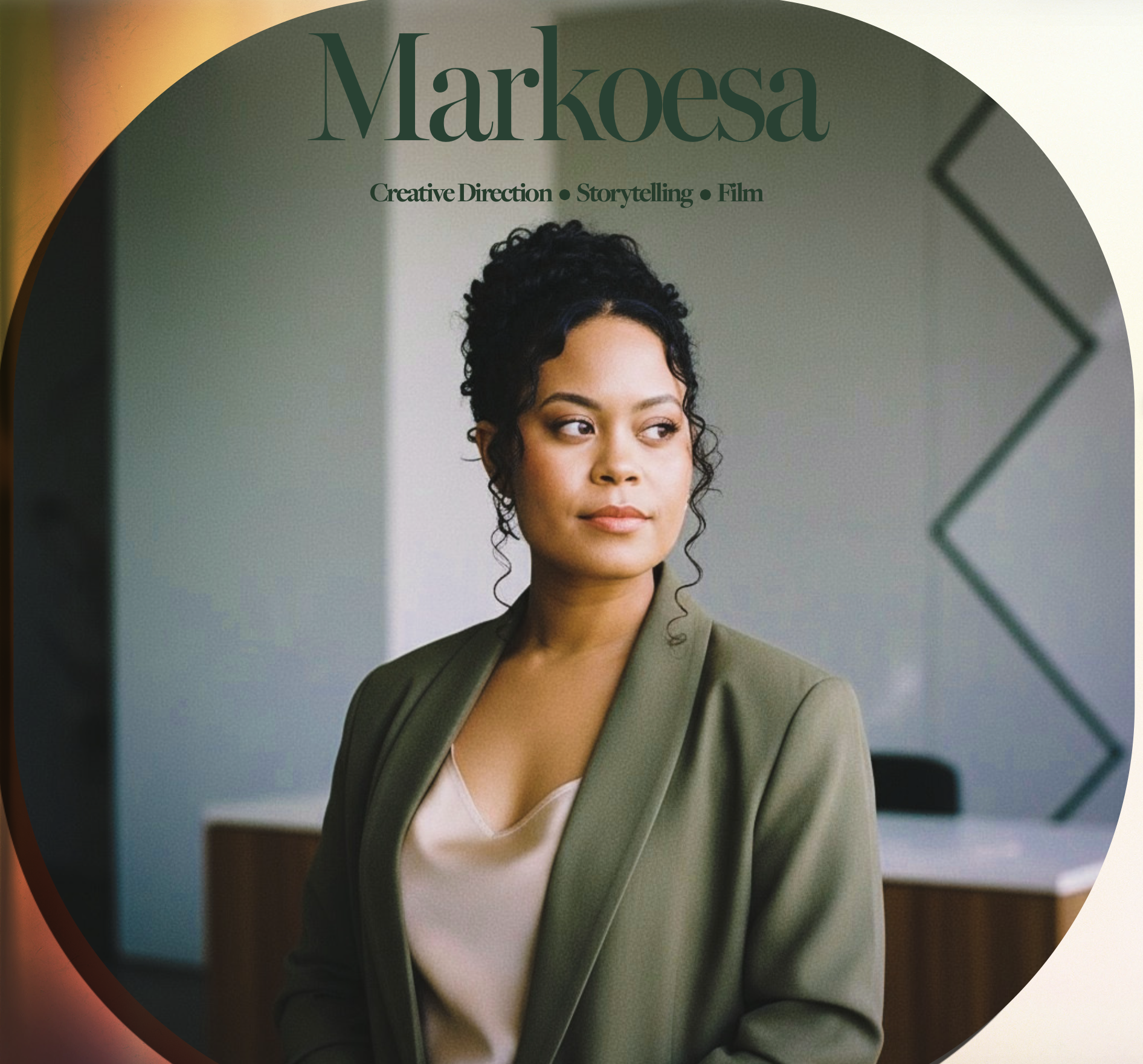 Portrait of a filmmaker in a green blazer, representing Markoesa Productions' creative direction and storytelling work